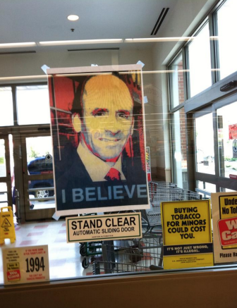 Portraits of Arthur T. DeMoulas are posted inside the Manchester, NH, Market Basket on Elm Street.
