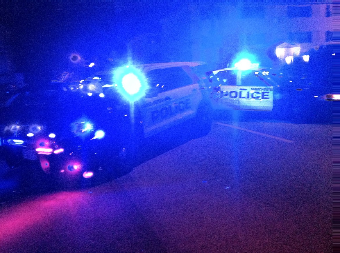 Police cars block Beech Street following a shooting Wednesday night.
