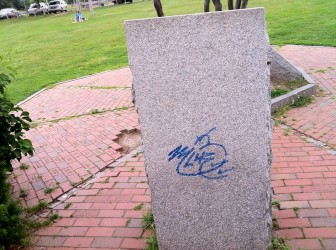 A tag on the granite monument at Derryfield Park.