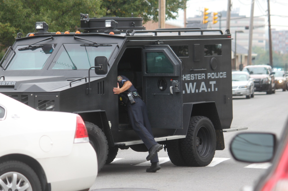 A Manchester Police SWAT team member waiting for word of the suspect's capture.
