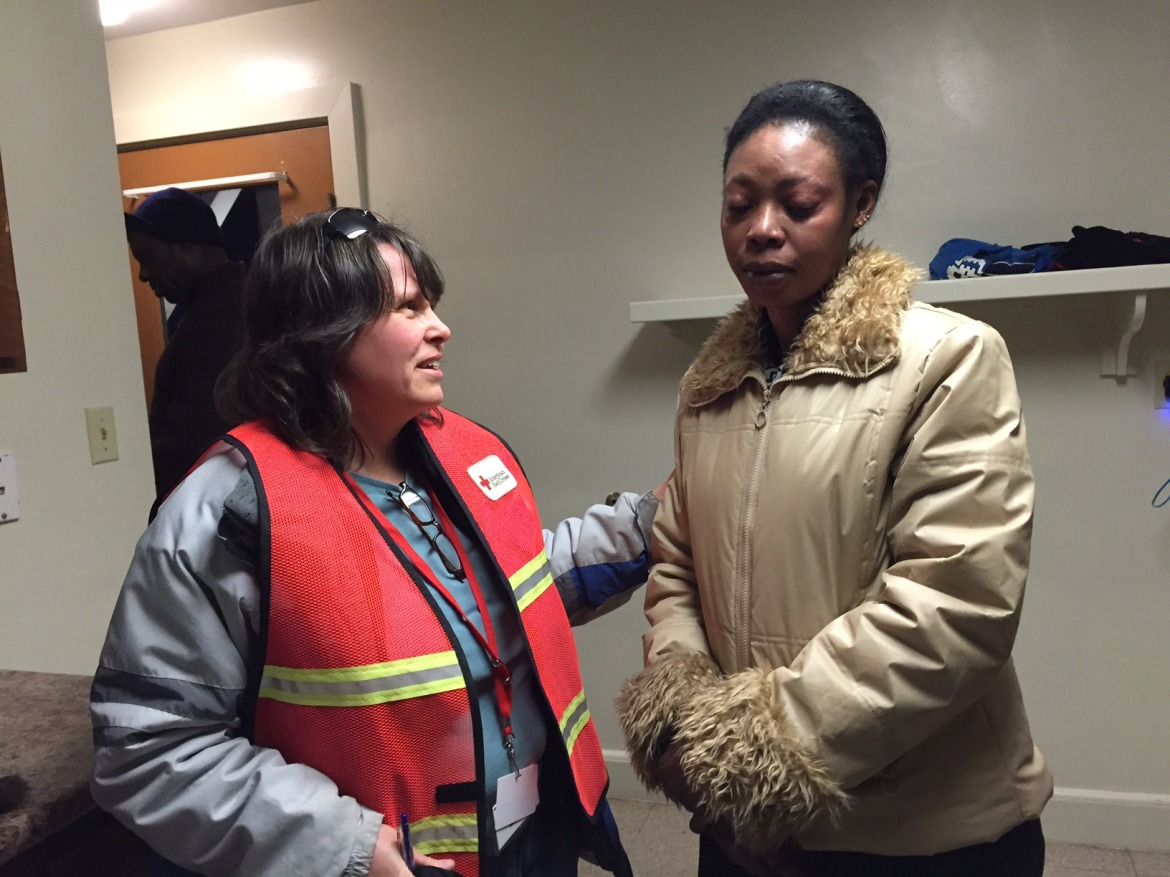 Kim Richards of the Red Cross assisting fire victim Nadia Osman after she was burned out of her apartment.