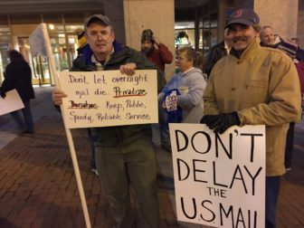 USPS union members Jim Breen, left, of Manchester, and Jim Oliver of Seabrook.