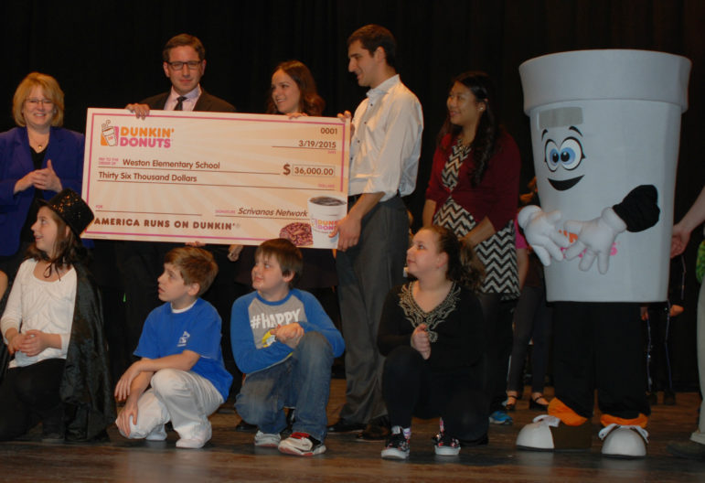Giant check means a $15,000 boost for Manchester students, thanks to Dunkin' Donuts.