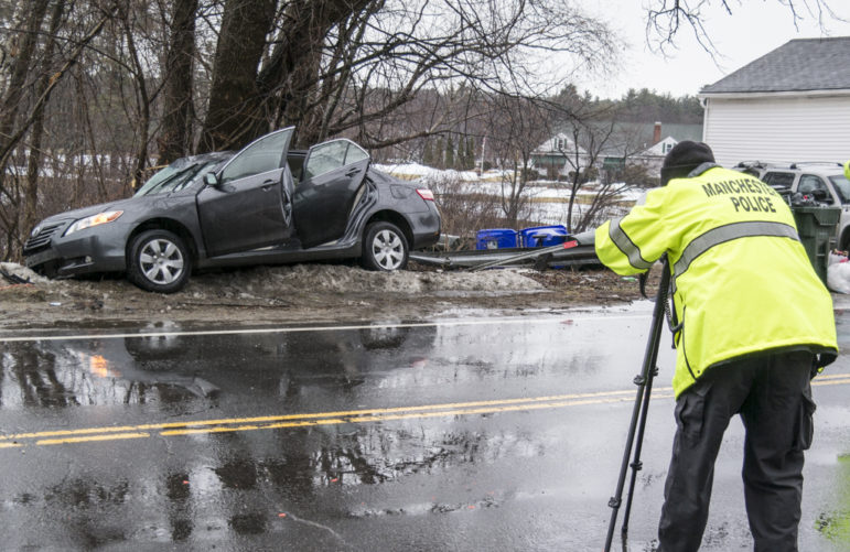 Police investigate scene of an accident on Front Street that happened early Friday morning.