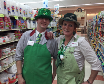 John Gagnon, left, and Suzi Bussiere, wearin' the green at Market Basket.