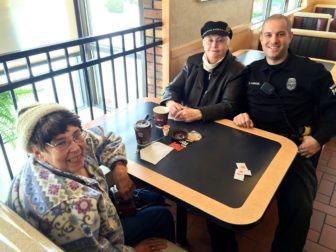 Sheila Pratt, left, Lucette Vallee, center, and Manchester Police Officer Brian Karoul at Second Street McDonald's.