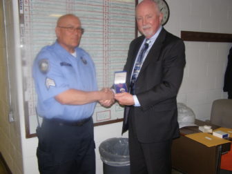 Corrections Sgt. Robert Parent receives commendation from NH Dept. of Corrections Commissioner William Wrenn.