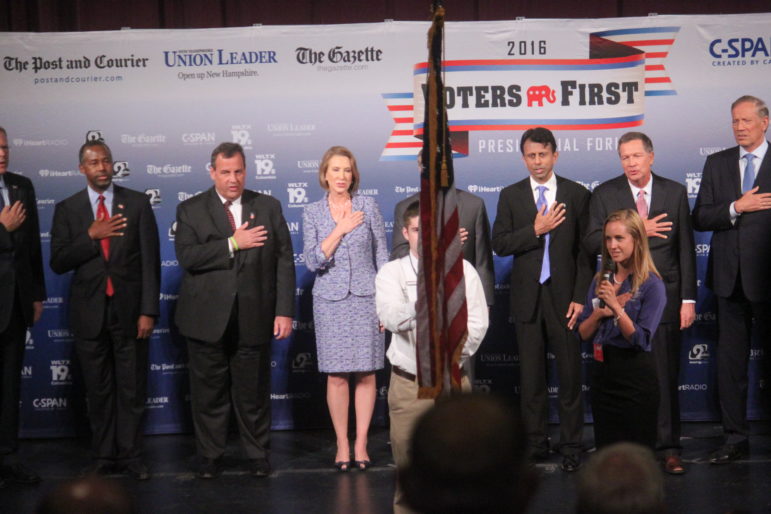 Candidates pledge allegiance at the start of the 2016 Voters First Presidential Forum.