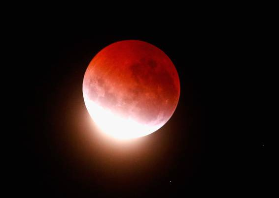 Some are convinced that the weird lunar events — a lunar eclipse on the same night as a Supermoon — will bring pull up the tides, bringing floods and earthquakes.