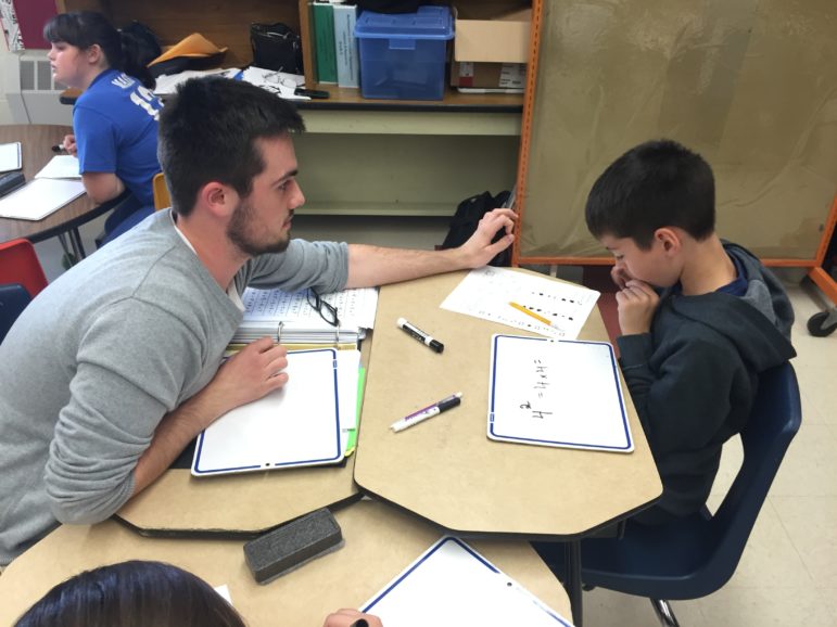 SNHU student Adam Mullen works with a Weston student during a work session.