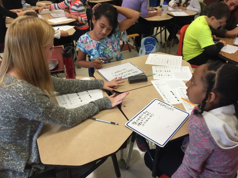 SNHU student Taylor MacDowell, left, working with Weston students.