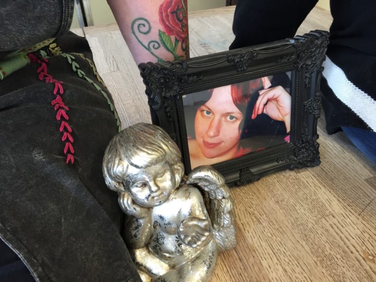 Photograph: Amber Blevens, and an angel statue given to Kriss Blevens by a mother whose child is addicted to heroin.