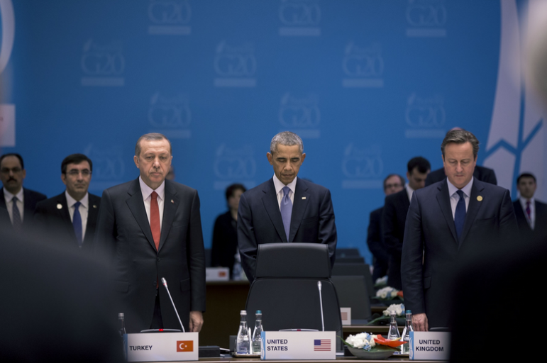 President Barack Obama, President Recep Tayyip Erdoğan of Turkey and Prime Minister David Cameron of the United Kingdom and the other members and staff of the G20 Summit, observe a moment of silence during Working Session One in Antalya, Turkey for the victims of the terrorist attacks in France, Sunday, Nov. 15, 2015. (