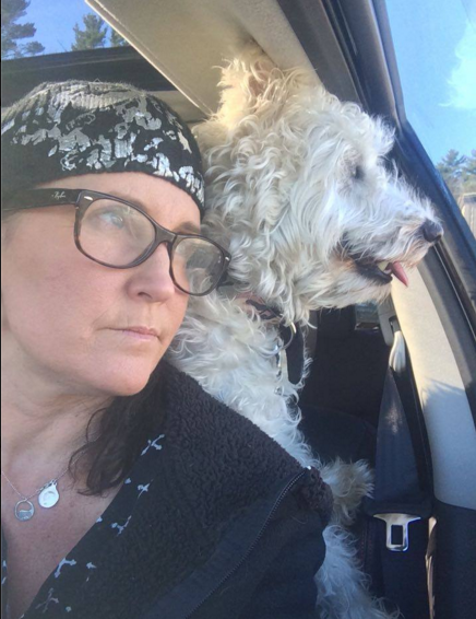 Kriss Blevens making the rounds with Curly, a dog whose drug-addicted owner abandoned him at a community recovery center.
