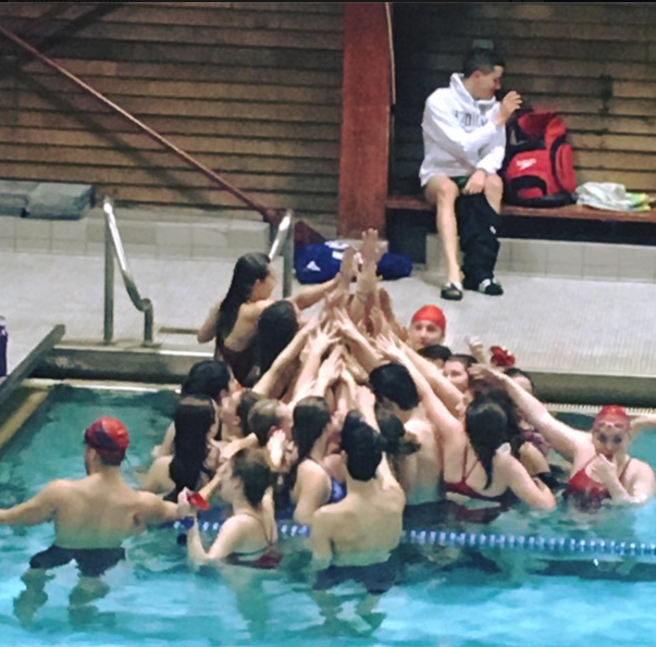 Memorial swim team in a moment of solidarity during the last practice of the season.