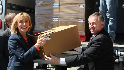 Governor Hassan and John Dumais, president & CEO of the NH Grocers Association, help unload a truck load of Nothing cans at the kickoff event today.