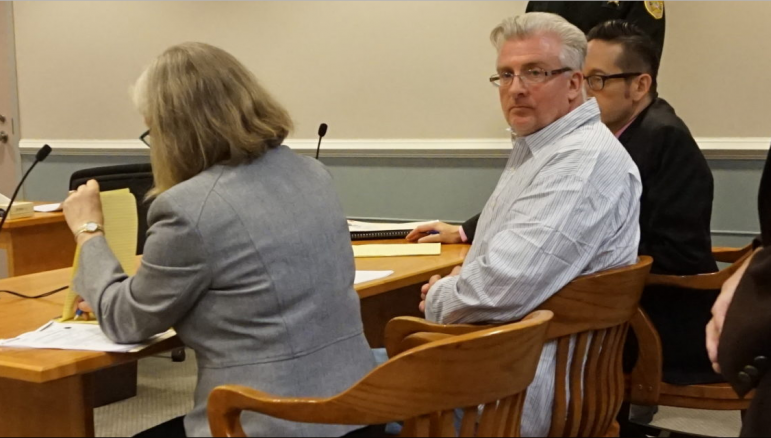 Eric Largy, center, is pictured with his public defenders, Suzanne Ketteridge, left, and Michael Davidow, on Friday in Hillsborough County Superior Court South in Nashua.