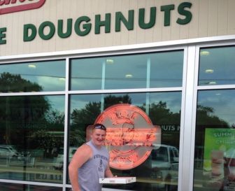 The author's son using the HotLightApp to score hot donuts at the original Krispy Kreme location in Raleigh, NC