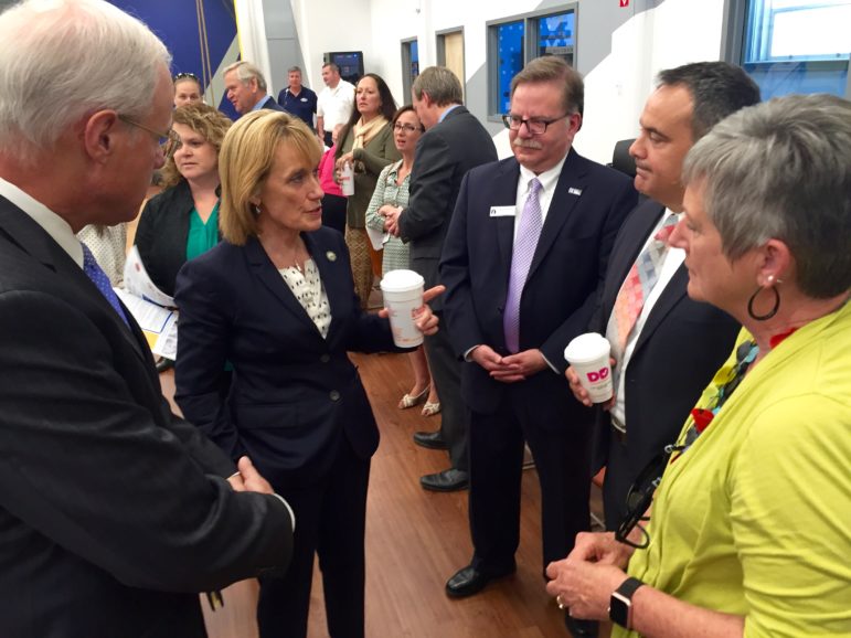 Gov. Maggie Hassan speaks with state and local officials prior to the meeting.
