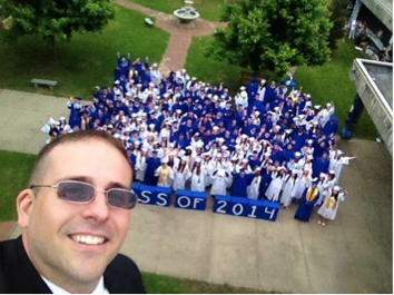 Chris Motika, with his first graduating class at West High School after joining the staff in July of 2013.