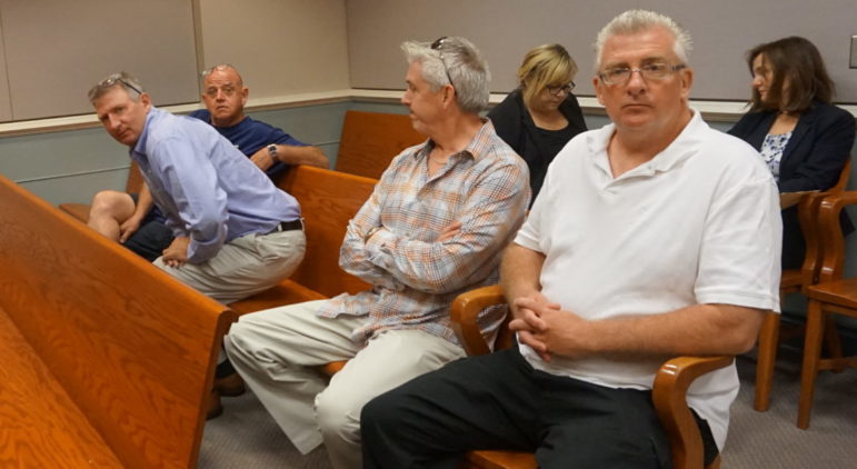 Eric Largy was reunited on Tuesday with his brother and uncle for the first time in seven years at a hearing in Hillsborough County Superior Court South in Nashua. From left, uncle Daniel Largy, brother Joseph Largy, friend Tom O'Brien, and Eric Largy.