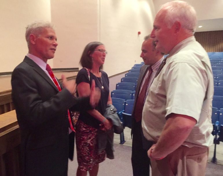 From left, Superintendent candidate Borgen Vargas, left, and his wife, Jill Conlon, chat with School Board members Rich Girard and Art Beaudry following a community forum at Memorial High School.