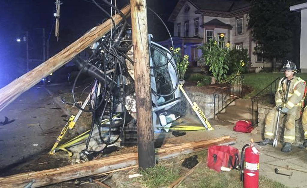 A car wound up tangled in electrical wires after hitting a pole on Hanover Street.
