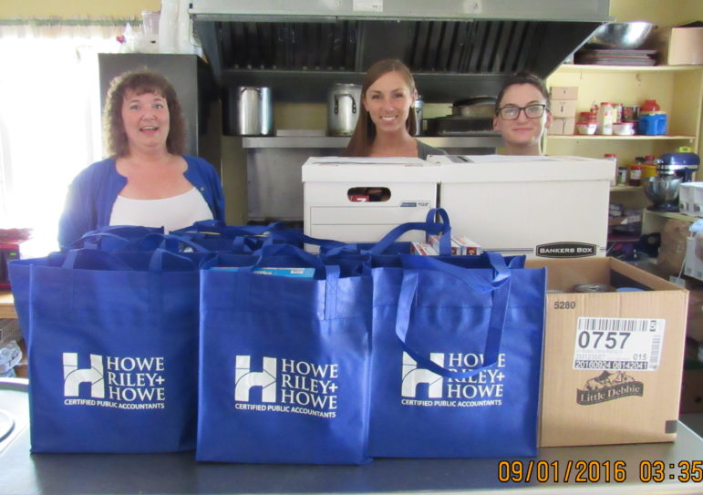 Donna Wageling, Kaylee Sullivan and Sarah Racicot of Howe, Riley & Howe, drop off a food donation to a Seacoast-area chapter of the End 68 Days of Hunger program on September 1. 