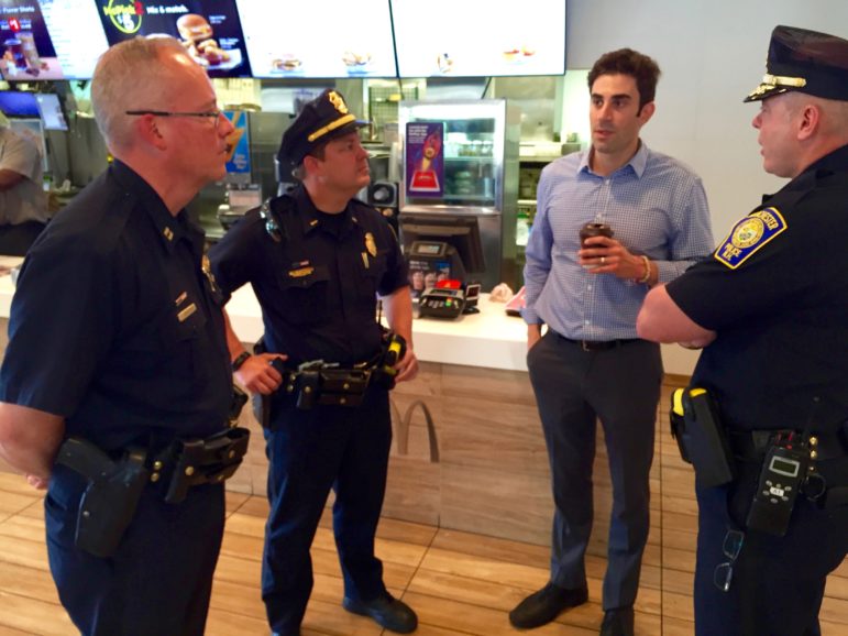 Michael Gamache, third from left, chats with, from left, Capt. Todd Boucher, Lt. Brian O'Keefe and Chief Nick Willard during a June Coffee with a Cop event at his Second Street McDonald's restaurant.