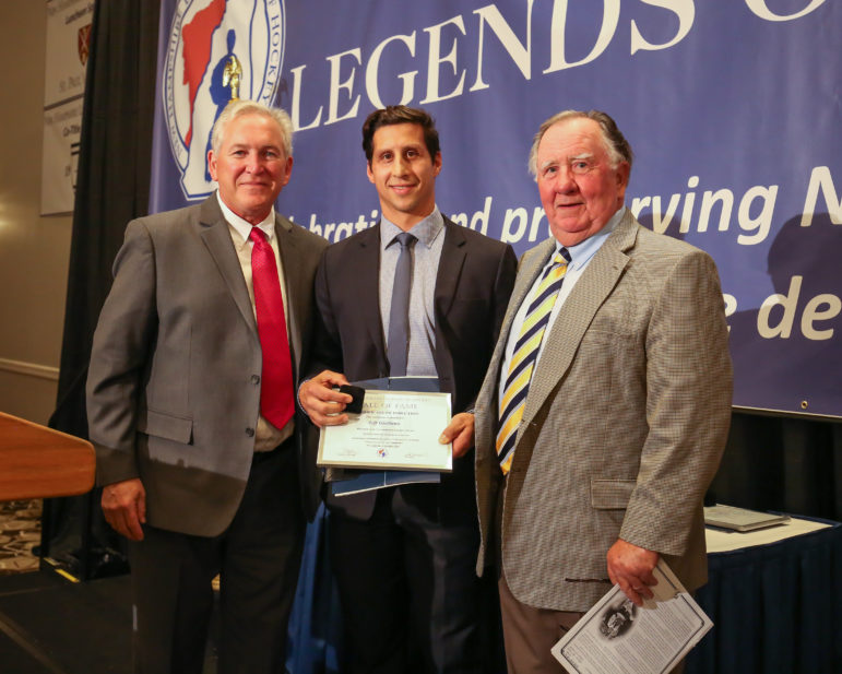 NH Legends 2016 Hockey Inductee Jeff Giuliano (center) accepts a ring and certificate from NH Legends President John Normand (L) and Master of Ceremonies Bob Norton at the 2016 NH Legends of Hockey Hall of Fame Induction Ceremony on Sunday October 23, 2016 @ Grappone Center, Concord, NH. 