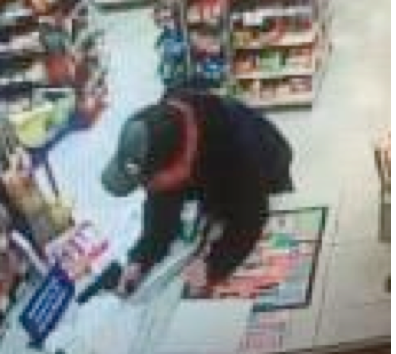 Screen grab from surveillance footage of robbery.