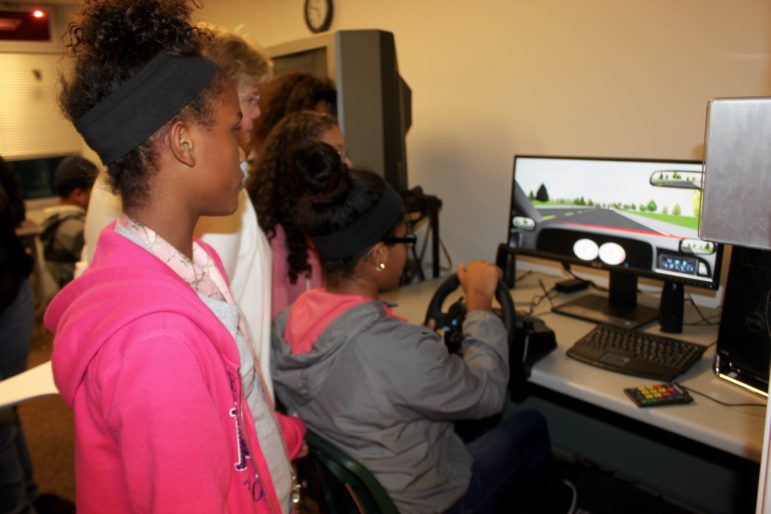 Genesis Gomez keeps both hands on the wheel during the Road Code simulator test.