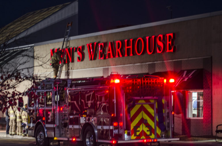 Fire crews responded to the Men's Wearhouse on Friday.