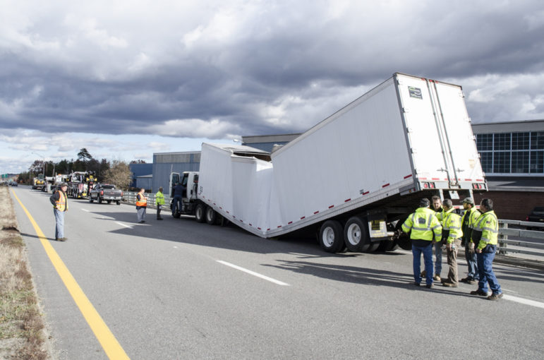 A tractor-trailer hauling bales of paper buckled and broke down on the Everett in Nashua.