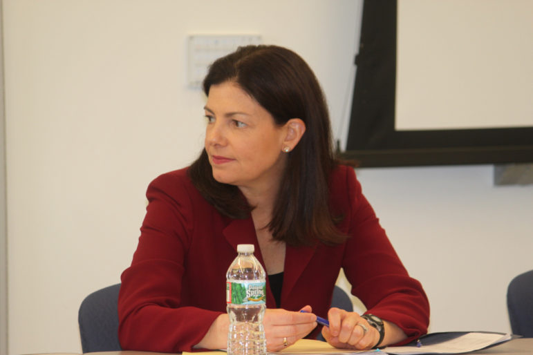 U.S. Sen. Kelly Ayotte, R-NH, listens to discussion by top NH officials on heroin/oxy addiction.