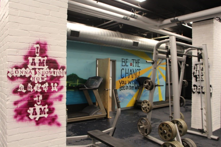 Throughout the Michael Briggs Community Center, Building on Hope’s most recent “Extreme Makeover” style renovation project, students will find uplifting and motivational images and quotes among their workout gear. The gym, located downstairs, is where students and Manchester police officers come to train and bond in a safe environment.