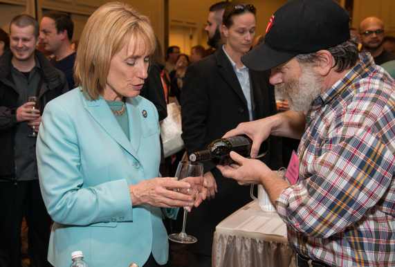 Jon Emmerich, winemaker at Silverado Vineyards, pours a sample for Governor Maggie Hassan during last year’s Winter Wine Spectacular.