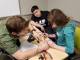 Students learn to solder with one of the STEM Labs advisory board members