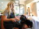 Erica Sowa drying client's hair