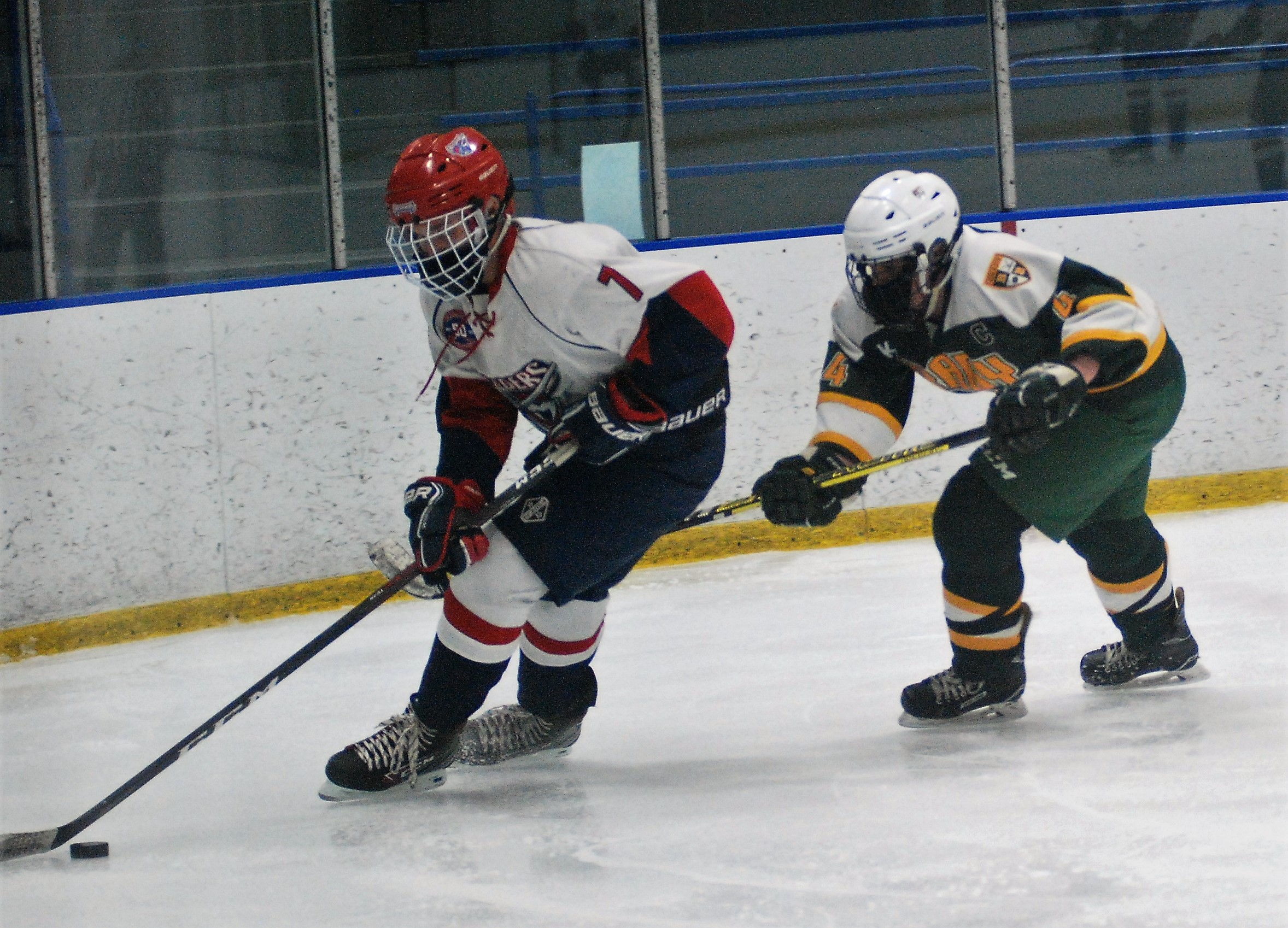 Collin Fields and Darren Earley chasing the puck.