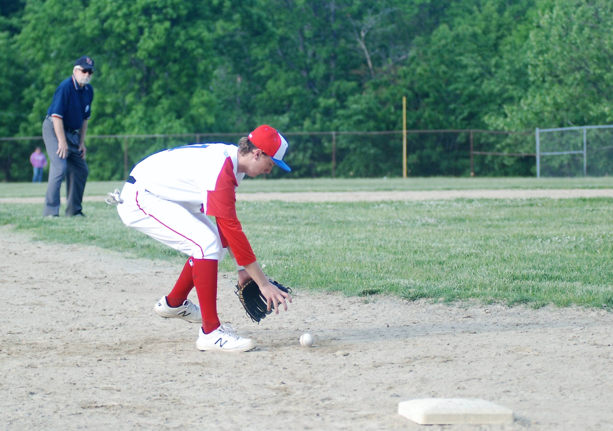 Third baseman Tyler Nolan scoops up a ground ball.