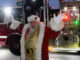 Santa arrives on Holt Avenue via fire truck. Photo/Andrew Sylvia