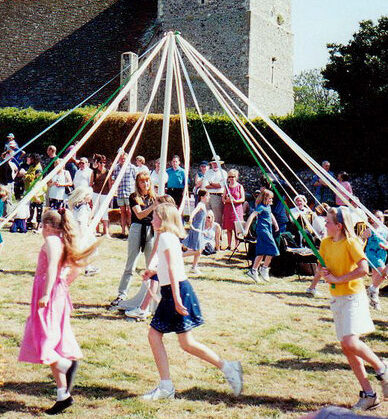 Maypole Dancing at Bishopstone Church Sussex geograph.org .uk 727031 e1682895553683