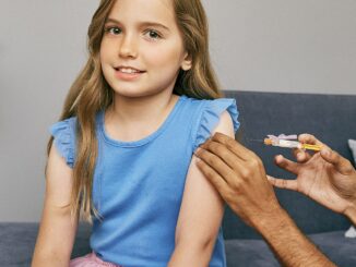 1280px Young girl about to receive a vaccine in her upper arm 48545990252